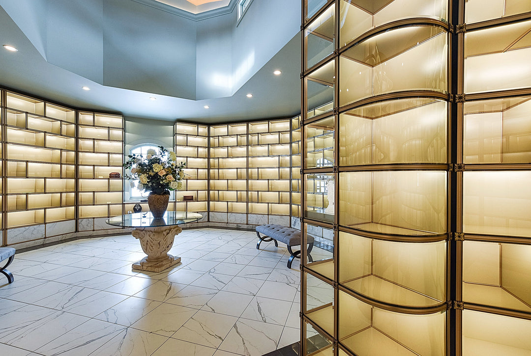 Premium curved glass-fronted niches with white marble fronts and lighting