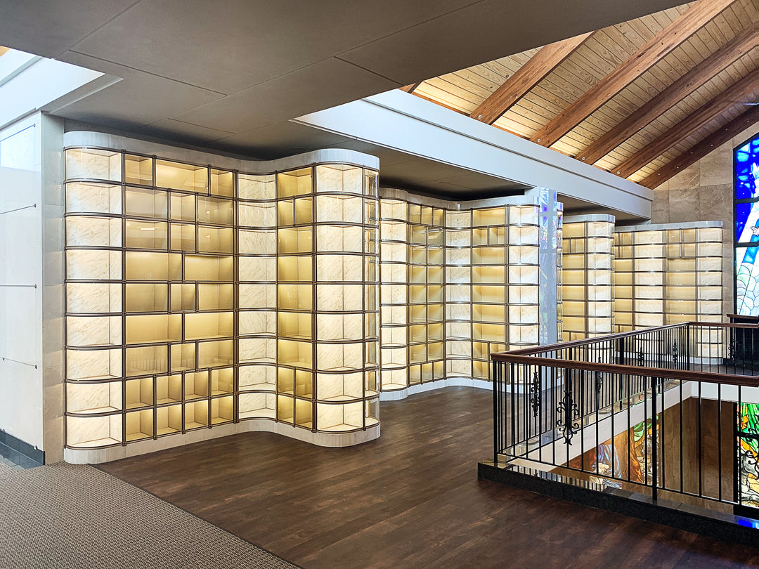 Curved glass-fronted niche wall with wave-pattern interior