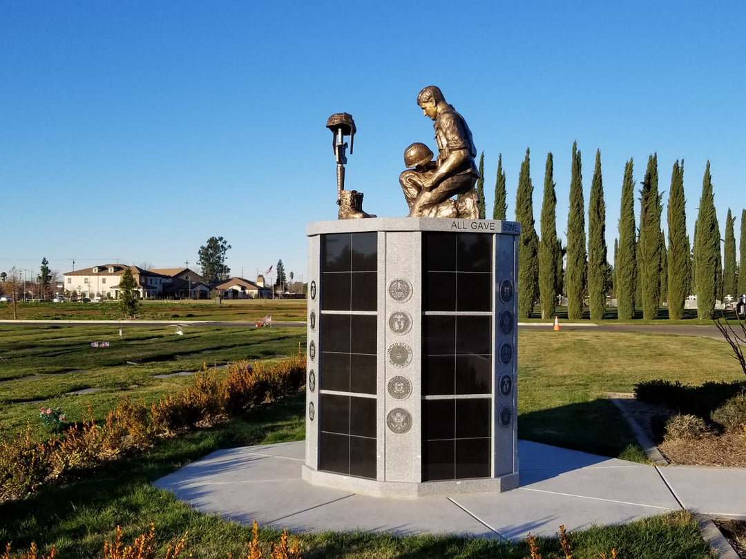 Granite Circular Columbarium with Bronze statue of kneeling soldier